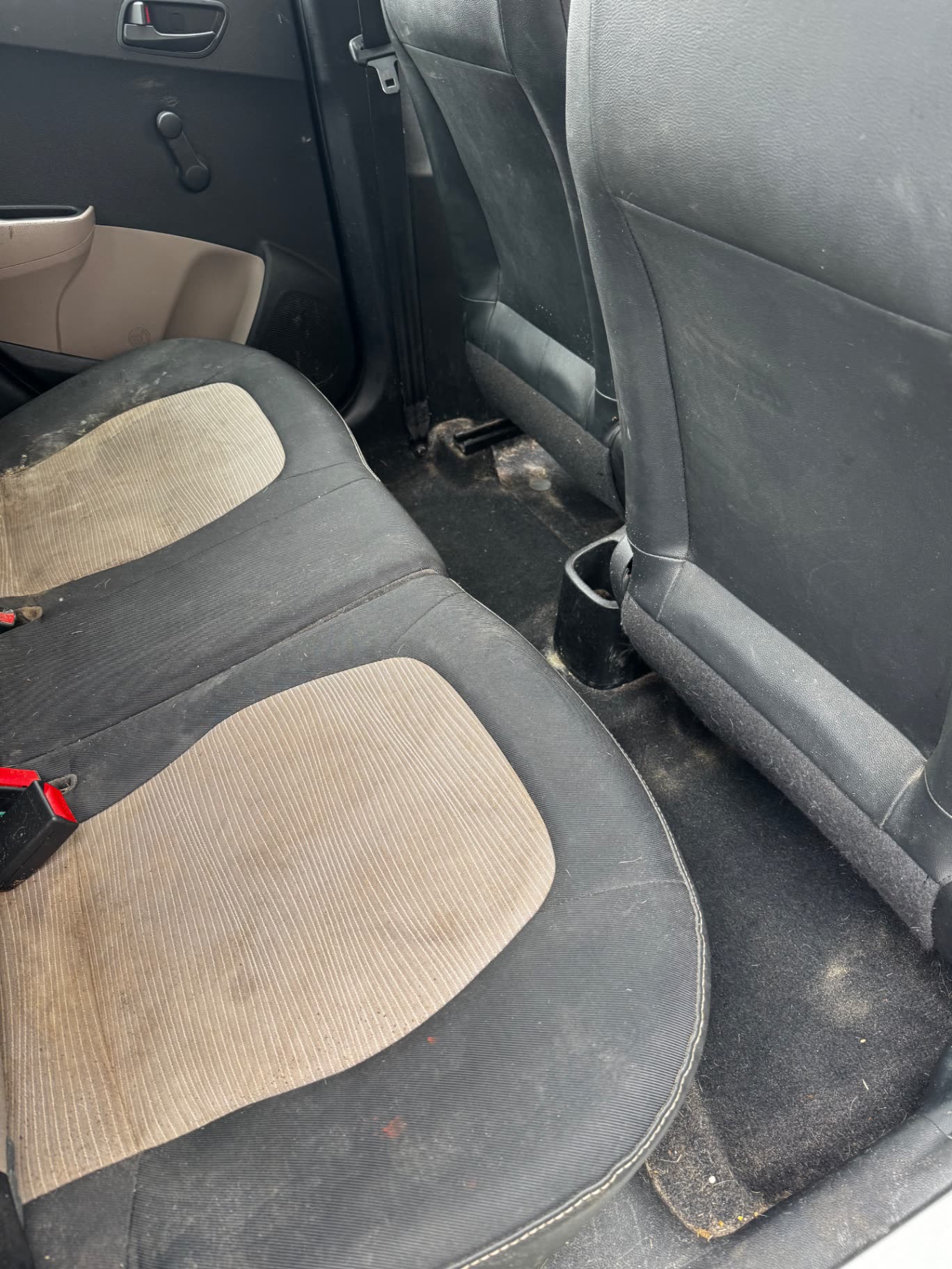Car rear seats and footwell before Detail Lab interior detailing